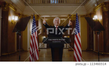 New President of the United States smiles and gestures during press campaign 113460314