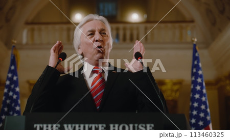 US government representative gives political speech at press conference 113460325
