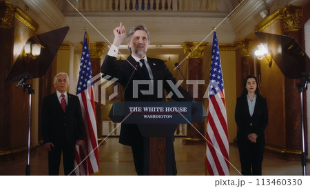 US President or congressman smiles and gestures after political speech 113460330