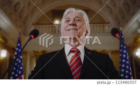 New President of the United States smiles and gestures during press campaign 113460357