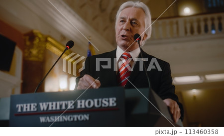 US President comes to tribune and pronounces emotional political speech 113460358