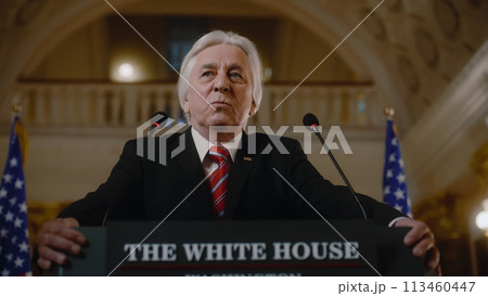 US President comes to tribune and pronounces emotional political speech 113460447