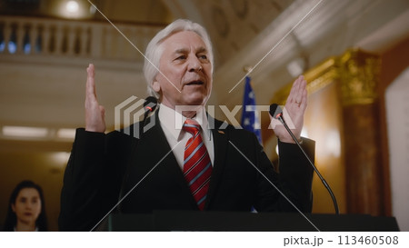 US government representative gives political speech at press conference US government representative gives political speech at press conference 113460508