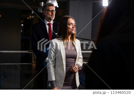Female EU politician poses for the cameras and greets journalists 113460520