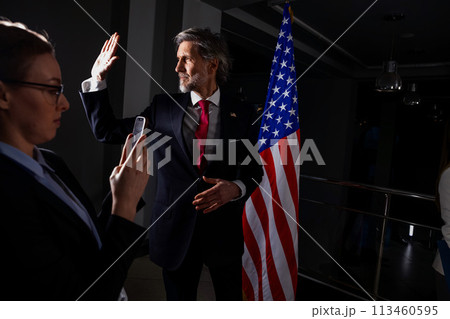 American politician at press conference after campaign speech 113460595