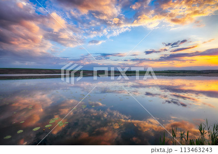 Amazing Dramatic sunset over the lake 113463243