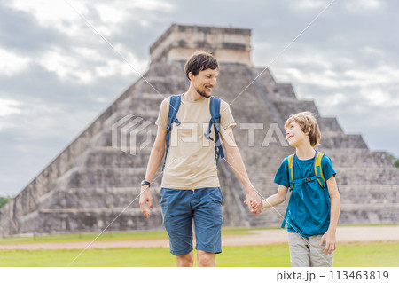Father and son tourists observing the old pyramid and temple of the castle of the Mayan architecture known as Chichen Itza these are the ruins of this ancient pre-columbian civilization and part of 113463819
