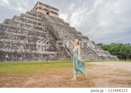 Beautiful tourist woman observing the old pyramid and temple of the castle of the Mayan architecture known as Chichen Itza these are the ruins of this ancient pre-columbian civilization and part of 113466125