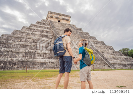 Father and son tourists observing the old pyramid and temple of the castle of the Mayan architecture known as Chichen Itza these are the ruins of this ancient pre-columbian civilization and part of 113466141