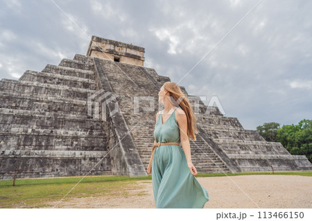Beautiful tourist woman observing the old pyramid and temple of the castle of the Mayan architecture known as Chichen Itza these are the ruins of this ancient pre-columbian civilization and part of 113466150