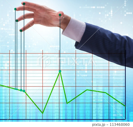Businessman controlling the market with strings 113468060