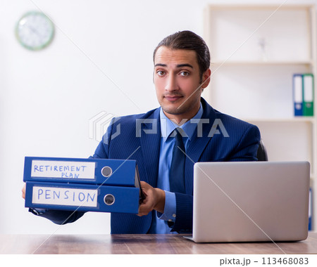 Young male accountant working in the office 113468083