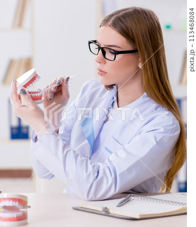 Dentistry student practicing skills in classroom 113468084