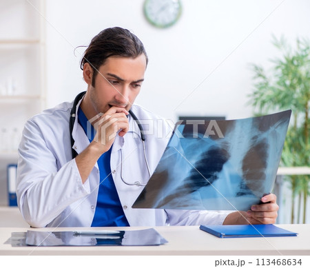 Young male doctor working in the clinic 113468634