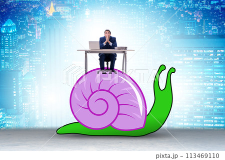 Businessman with snail in slow business concept Businessman with snail in slow business concept 113469110