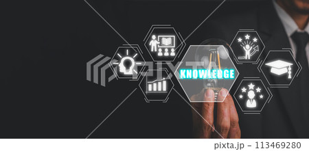 Knowledge concept, Businessman hand holding lightbulb with knowledge icon on virtual screen. Knowledge concept, Businessman hand holding lightbulb with knowledge icon on virtual screen. 113469280
