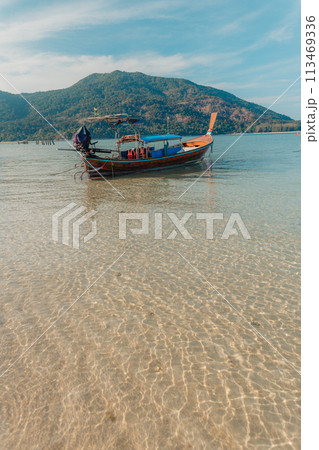 Wooden boat on the beach on the island Wooden boat on the beach on the island 113469336
