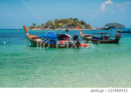 Wooden boat on the beach on the island Wooden boat on the beach on the island 113469352