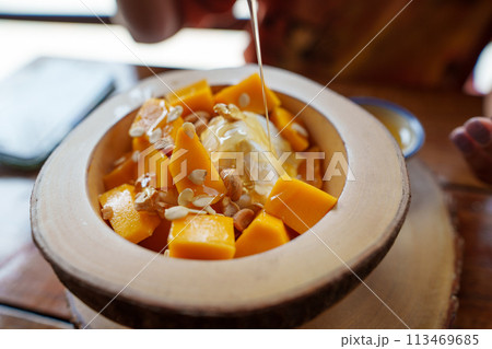Mango yogurt on the table in a dessert shop 113469685