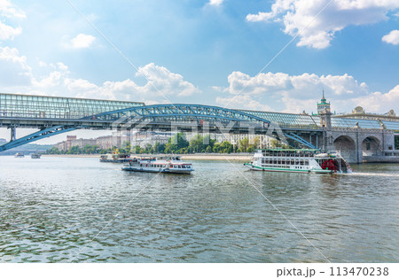 View of the Moscow river embakment, Pushkinsky bridge and cruise ships at sunset. 113470238