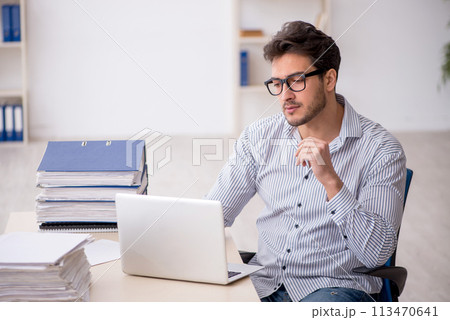 Young male employee working in the office 113470641