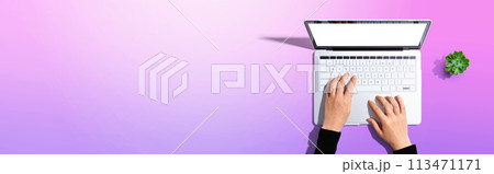 Person using a laptop computer Person using a laptop computer 113471171