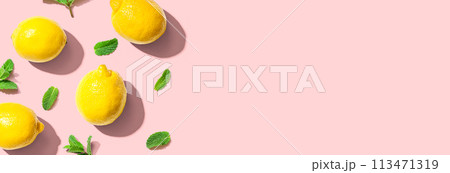 Fresh yellow lemons with mints overhead view 113471319