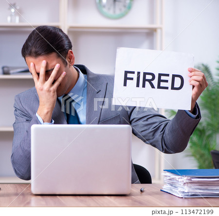 Young male employee being fired from his work 113472199