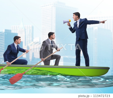 The team of businessmen in teamwork concept with boat 113472723