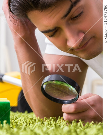 Young husband man cleaning floor at home 113472766