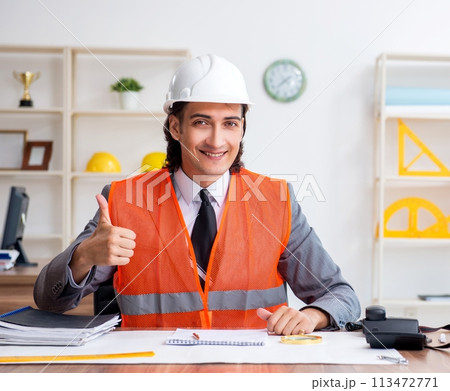 Young male architect working in the office 113472771