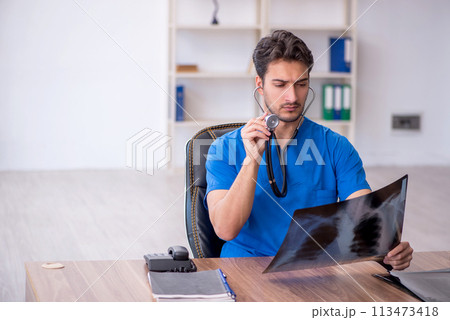 Young male doctor radiologist working in the clinic Young male doctor radiologist working in the clinic 113473418