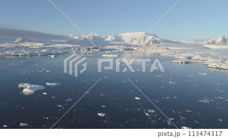 Polar Antarctic Vernadsky Station Aerial View. Ocean Coast Open Water Surface. South Pole Settlement Base Landscape Drone Flight Polar Antarctic Vernadsky Station Aerial View. Ocean Coast Open Water Surface. South Pole Settlement Base Landscape Drone Flight 113474317