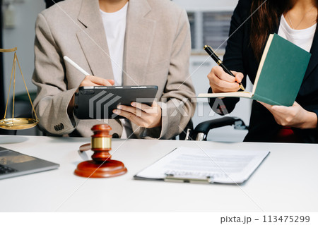Business and lawyers discussing contract papers with brass scale on desk. Law, legal services, advice,  justice and law concept .. 113475299