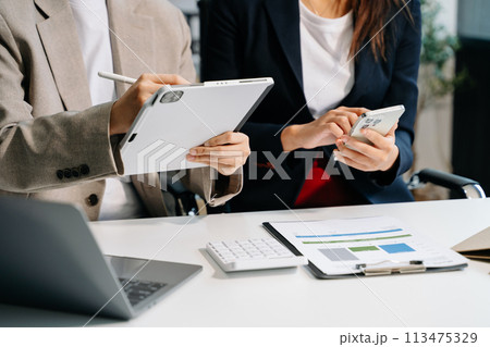 Businessman and team analyzing financial statement Finance task. with smart phone and laptop and tablet. Wealth management concept. Businessman and team analyzing financial statement Finance task. with smart phone and laptop and tablet. Wealth management concept. 113475329