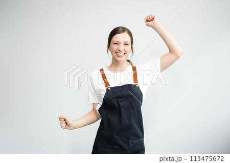 Woman entrepreneur or shop owner. Isolated small business owner or barista with apron on white background. Woman entrepreneur or shop owner. Isolated small business owner or barista with apron on white background. 113475672