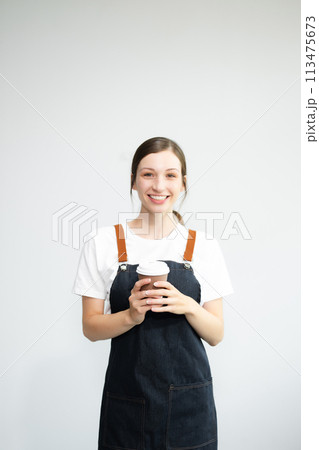 Woman entrepreneur or shop owner. Isolated small business owner or barista with apron on white background. Woman entrepreneur or shop owner. Isolated small business owner or barista with apron on white background. 113475673