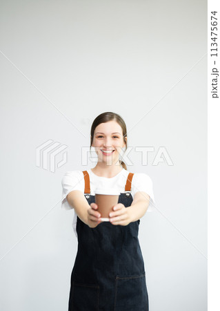 Woman entrepreneur or shop owner. Isolated small business owner or barista with apron on white background. 113475674