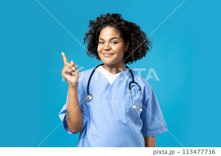 A young African American woman in a doctor's uniform 113477736