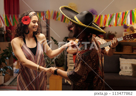 Couple holding by hands during dance Couple holding by hands during dance 113477862
