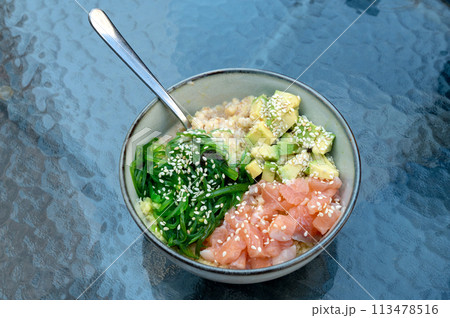Hawaiian cuisine, couscous with fish and vegetables. Rice combined with fish and fresh vegetables 113478516