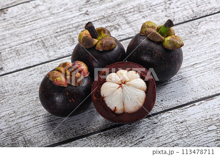 Sweet ripe juicy tropical Mangosteen 113478711