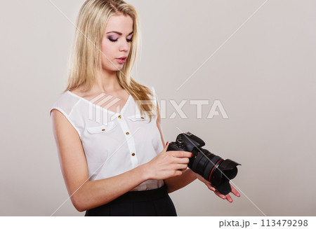 Beautiful woman with camera. Beautiful woman with camera. 113479298