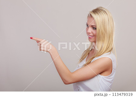 woman showing copy space pointing with finger 113479319