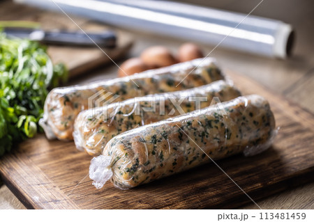 Preparation of Karlovy Vary dumplings wrapped in plastic foil. Traditional Czech dumpling Preparation of Karlovy Vary dumplings wrapped in plastic foil. Traditional Czech dumpling 113481459