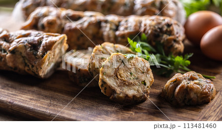 Traditional Czech Karlovy Vary dumplings on a cutting board 113481460