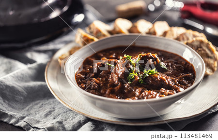 Traditional Viennese, venison or Hungarian goulash with Karlovy Vary dumplings and red wine 113481469