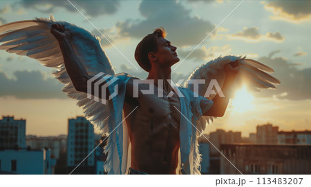 Caucasian male angel with white wings in the city. 113483207