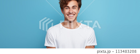 Caucasian man wearing a t-shirt on a blue background. Caucasian man wearing a t-shirt on a blue background. 113483208
