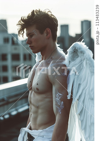 Caucasian male angel with white wings in the city. 113483239